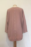 JUMPER WITH PEARL BUTTON BACK DETAIL, CURVED HEMLINE AND ROUNDED NECKLINE WITH 2 FRONT POCKETS