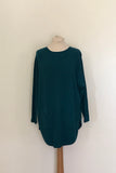 JUMPER WITH PEARL BUTTON BACK DETAIL, CURVED HEMLINE AND ROUNDED NECKLINE WITH 2 FRONT POCKETS