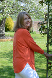 JUMPER WITH PEARL BUTTON BACK DETAIL, CURVED HEMLINE AND ROUNDED NECKLINE WITH 2 FRONT POCKETS