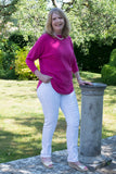 JUMPER WITH PEARL BUTTON BACK DETAIL, CURVED HEMLINE AND ROUNDED NECKLINE WITH 2 FRONT POCKETS