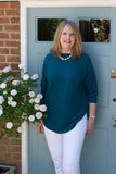 JUMPER WITH PEARL BUTTON BACK DETAIL, CURVED HEMLINE AND ROUNDED NECKLINE WITH 2 FRONT POCKETS