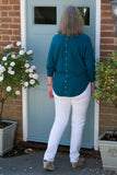 JUMPER WITH PEARL BUTTON BACK DETAIL, CURVED HEMLINE AND ROUNDED NECKLINE WITH 2 FRONT POCKETS