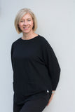 JUMPER WITH PEARL BUTTON BACK DETAIL, CURVED HEMLINE AND ROUNDED NECKLINE WITH 2 FRONT POCKETS