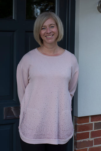 ROUND NECK JUMPER WITH FRONT POCKETS AND SIDE BUTTON DETAIL