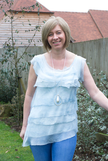 SLEEVELESS SILK RUFFLE TOP